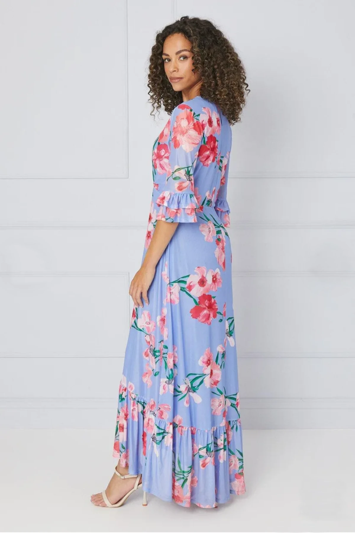 Luna and Bloom Press page image of female model in pale blue fit and flare dress with pink floral effect