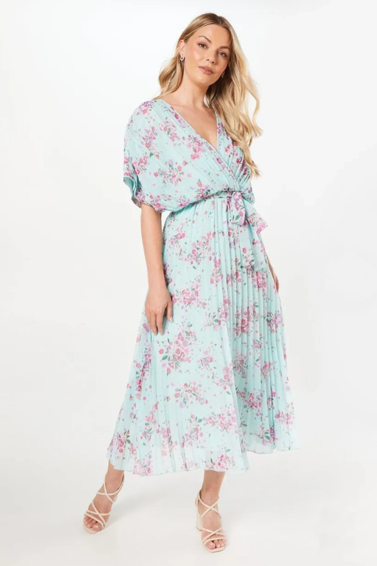 Luna and Bloom Press page image of female model in pale turquoise floral dress
