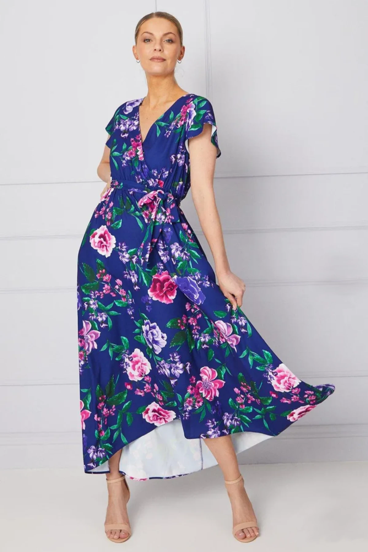 Luna and Bloom Press page image of female model in short sleeve blue dress with contrasting floral effect